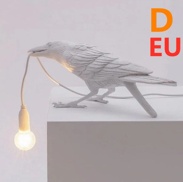 Creative Auspicious Bird Resin Wall Light with white perching bird and hanging bulb cord on Tampa Home & Garden Store