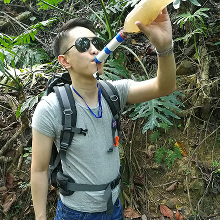 Outdoor Water Filter Camping Survival Tool blue-white filter straw used by man with backpack on Tampa Home & Garden Store