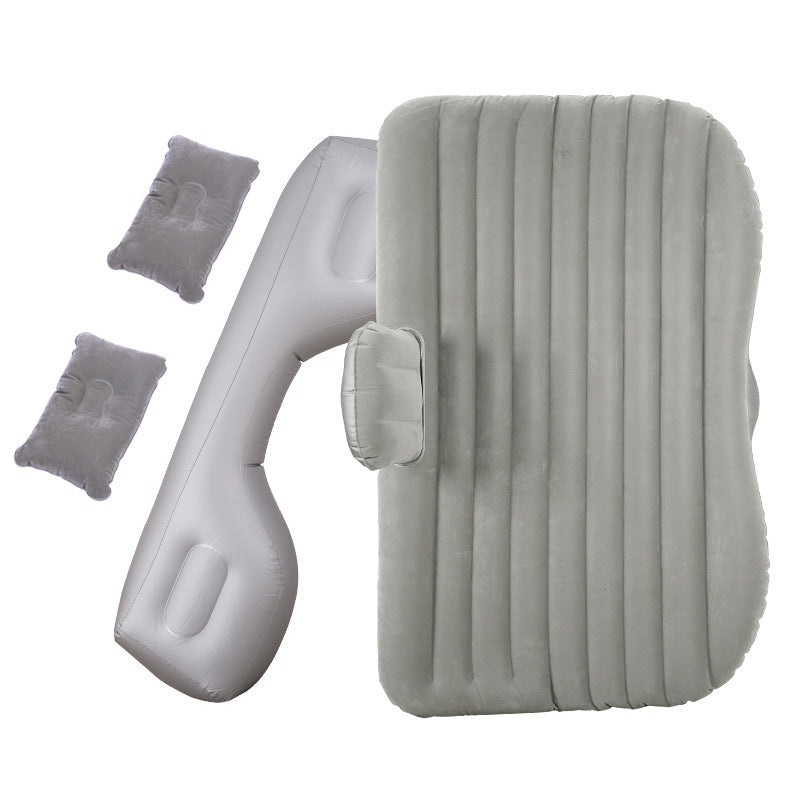Inflatable car mattress with ribbed gray sleeping pad, headrest pillow, and two small cushions on Tampa Home & Garden Store