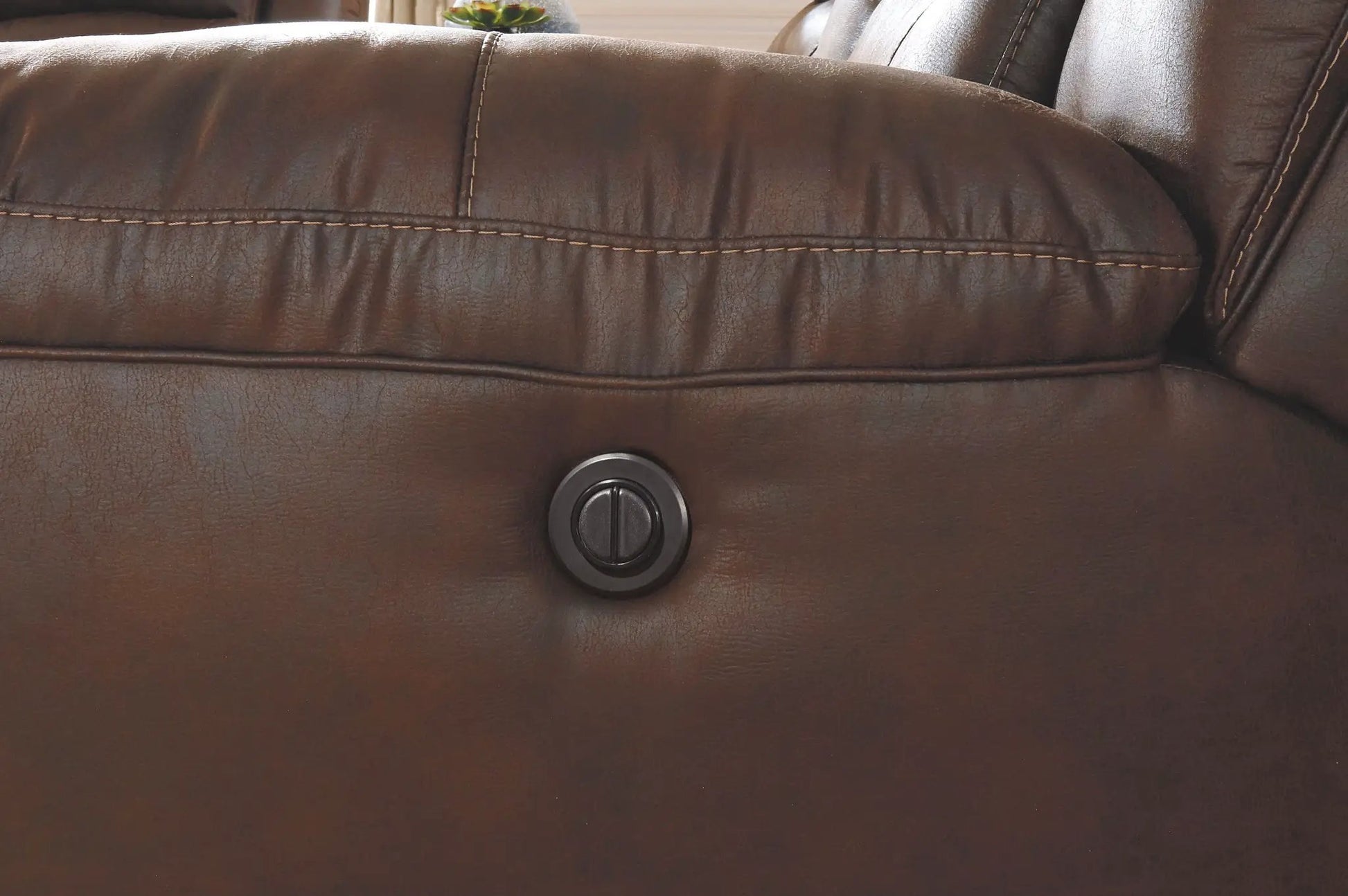 Stoneland Power Recliner brown leather rocker chair with visible stitches and control dial on Tampa Home & Garden Store