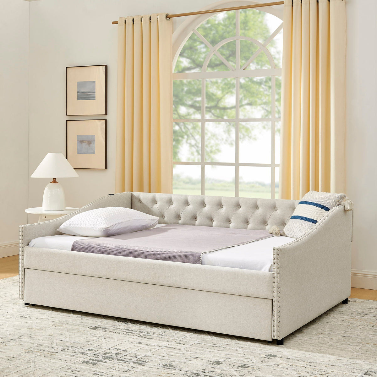 Upholstered daybed in light gray fabric with tufted back and nailhead trim, pullout bed on Tampa Home & Garden Store