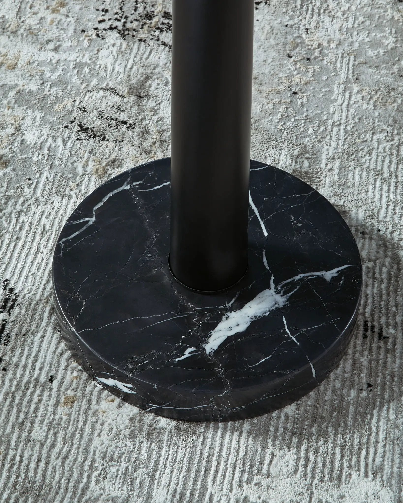 Sorcha metal floor lamp black cylindrical stem atop round black marble base with white veining on Tampa Home & Garden Store