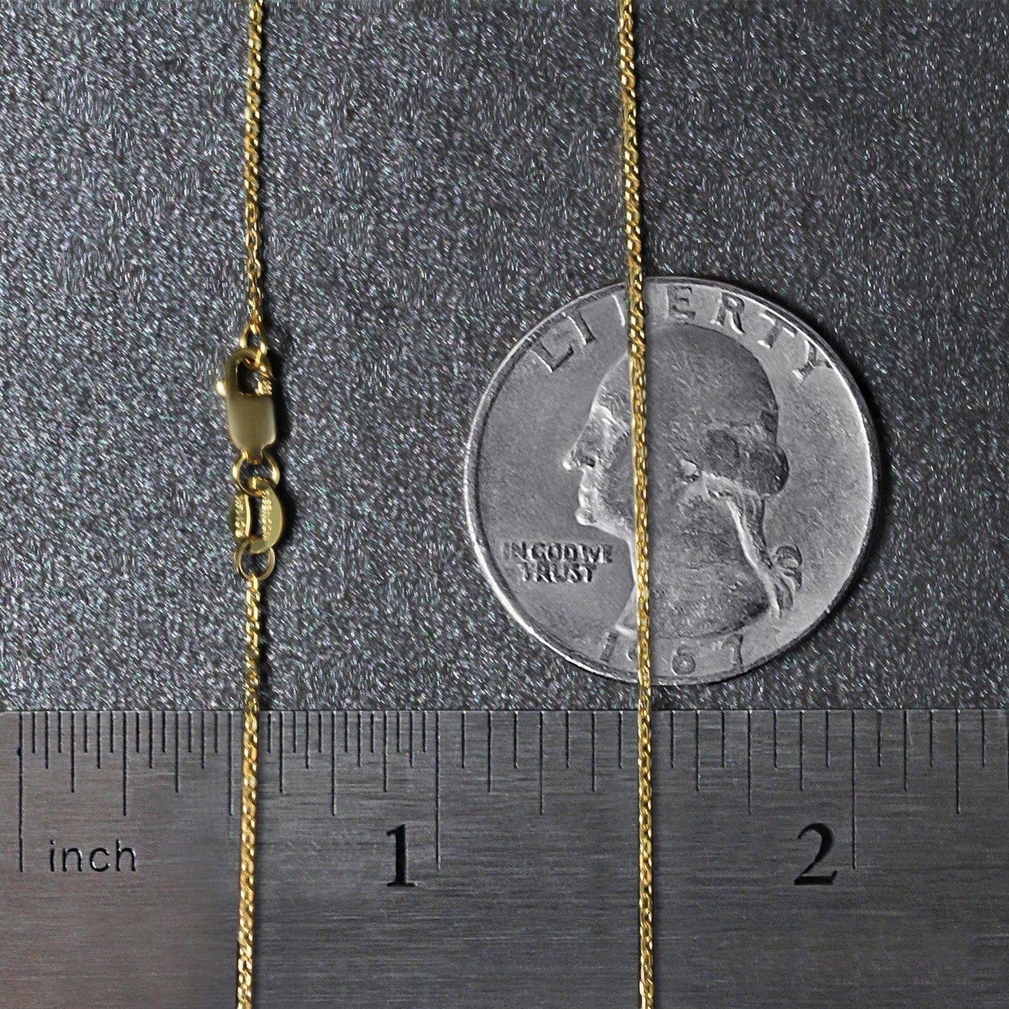 14k yellow gold diamond-cut cable link necklace, 0.8mm, with clasp beside a quarter for scale on Tampa Home & Garden Store