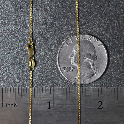 14k yellow gold diamond-cut cable link necklace, 0.8mm, with clasp beside a quarter for scale on Tampa Home & Garden Store