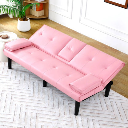 Pink tufted futon sofa bed with black legs in a bright living room on Tampa Home & Garden Store