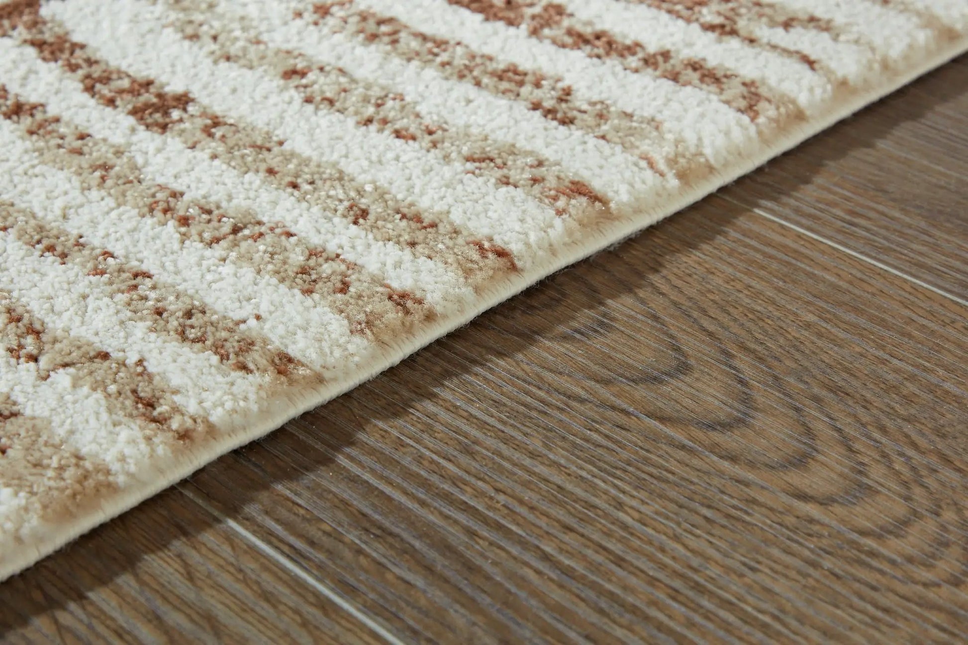 Uduak rug, beige cream and brown abstract pattern, plush pile, bound edge on Tampa Home & Garden Store