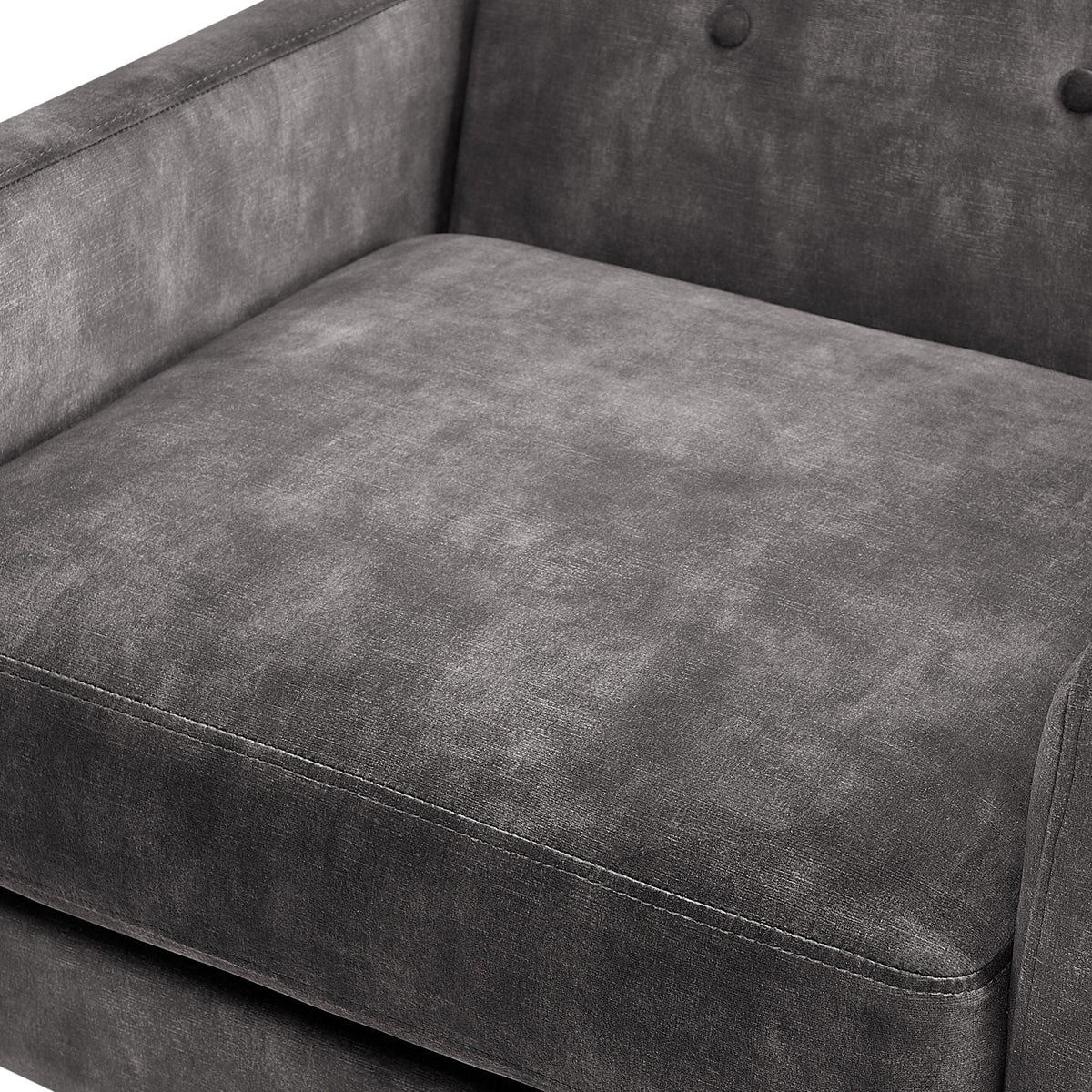 Tufted back accent armchair upholstery close-up in dark gray fabric with visible stitching on Tampa Home & Garden Store