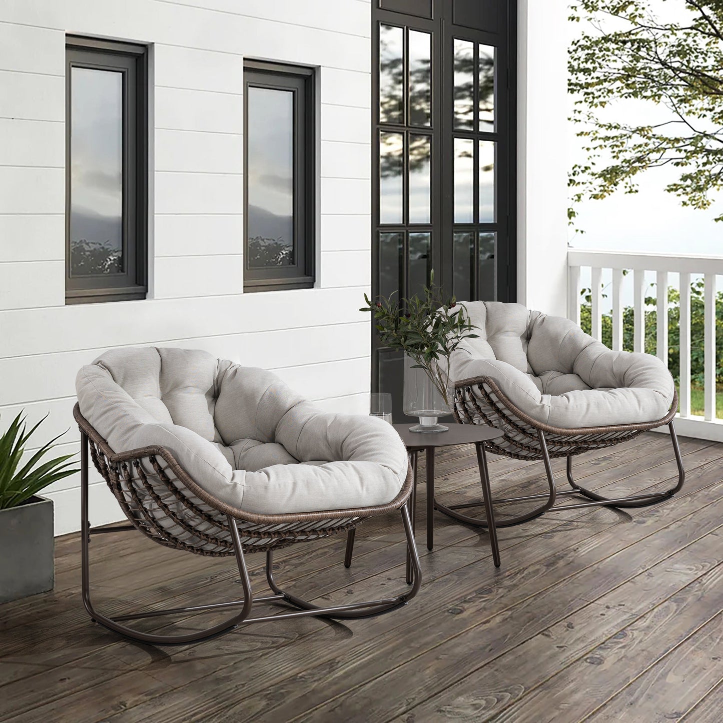 Outdoor rattan rocking chairs with padded beige cushions, brown wicker frames, pair on deck on Tampa Home & Garden Store