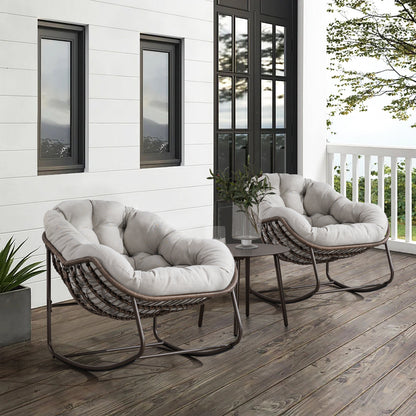Outdoor rattan rocking chairs with padded beige cushions, brown wicker frames, pair on deck on Tampa Home & Garden Store