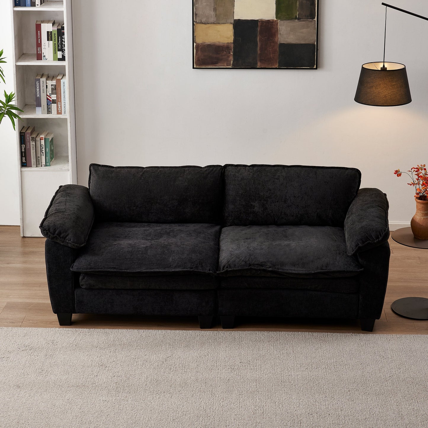 Black chenille loveseat sofa with plush cushions, large luxury couch in a cozy living room on Tampa Home & Garden Store