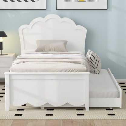 Platform bed with white scalloped headboard and integrated trundle in a pastel blue bedroom on Tampa Home & Garden Store