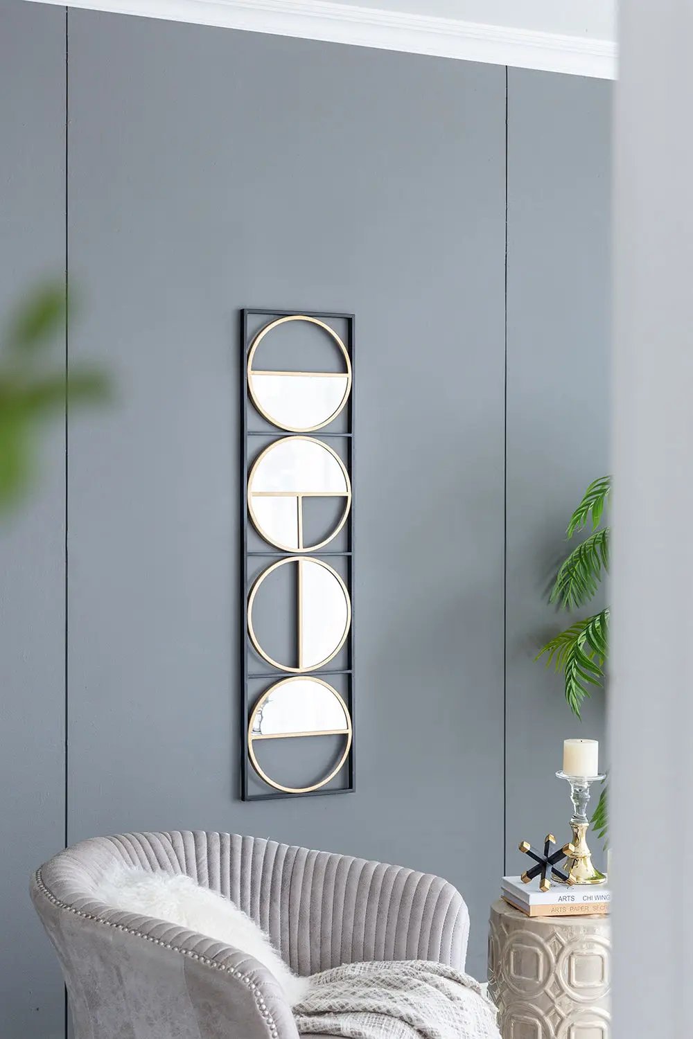 Eclectic metal beaded wall mirror with vertical black frame and four round mirrors on Tampa Home & Garden Store