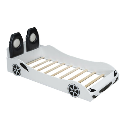Race car shaped platform bed with black upholstered backrests, white frame and wheel decals on Tampa Home & Garden Store