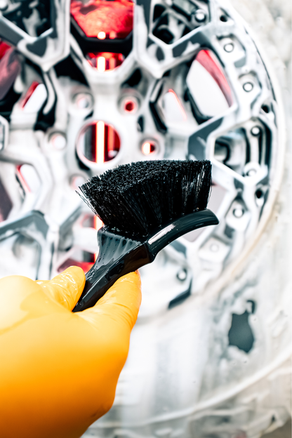 BLACKLINE STIFF BRISTLE TIRE BRUSH with black bristles, orange glove in foreground on Tampa Home & Garden Store