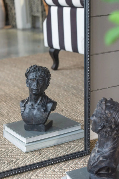 Arch Mirror with a black beaded frame, Baroque-inspired wall decor near striped chair and bust on Tampa Home & Garden Store