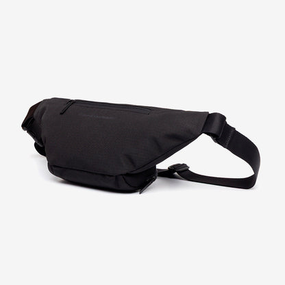 Atlas Lefrik USA crossbody bag in black fabric with front zip pocket and adjustable strap on Tampa Home & Garden Store