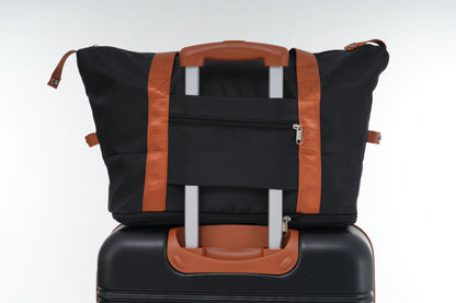 HouseOfZazla black luggage bag with orange straps and brown handle on a spinner suitcase on Tampa Home & Garden Store
