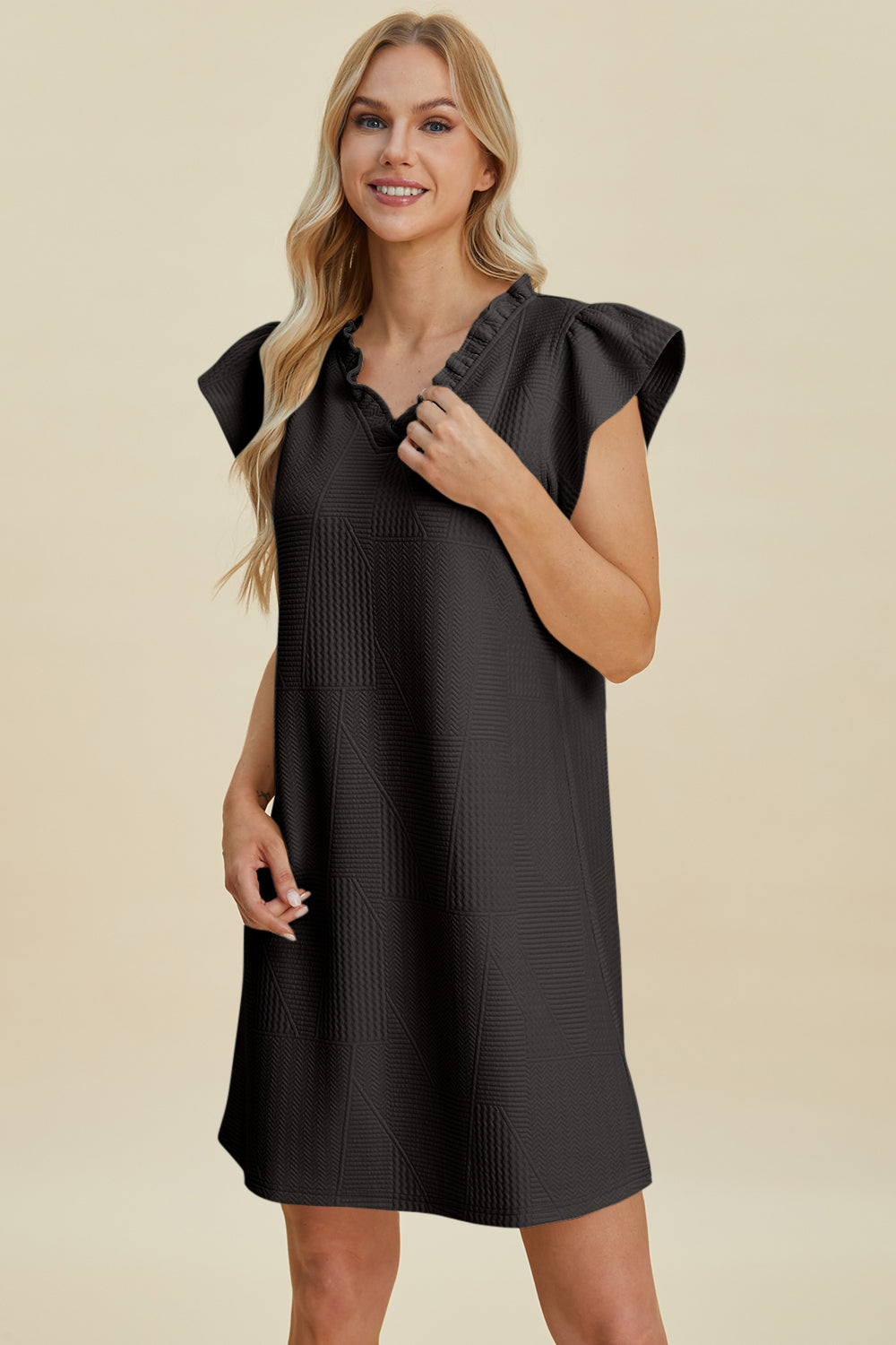 Stevvex Double Take Ruffled V-Neck Cap Sleeve Dress in black with textured panels on Tampa Home & Garden Store