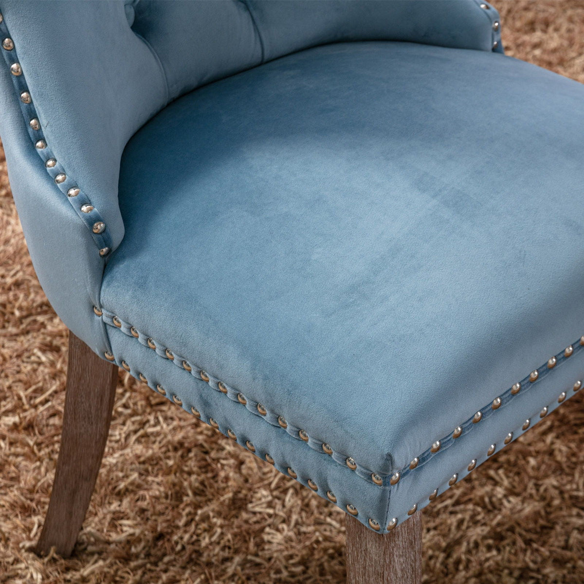 Tufted velvet dining chair set in blue with nailhead trim on Tampa Home & Garden Store