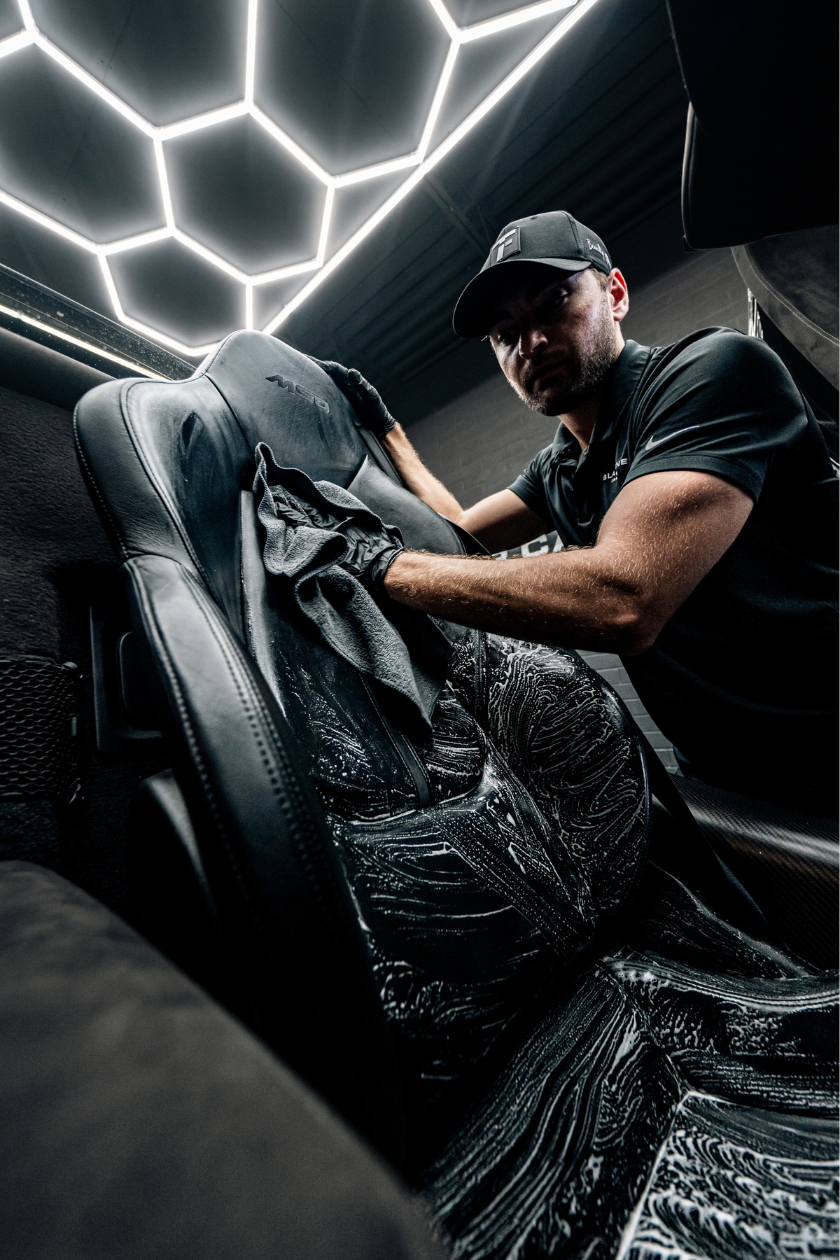 Blackline Everyday edgeless microfiber towels for vehicle cleaning laid on dark car seat on Tampa Home & Garden Store