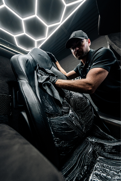 Blackline Everyday edgeless microfiber towels for vehicle cleaning laid on dark car seat on Tampa Home & Garden Store