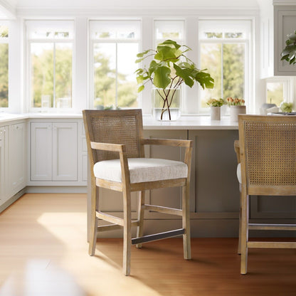 Pair of cane-back counter stools with cream upholstered seats in reclaimed natural wood on Tampa Home & Garden Store