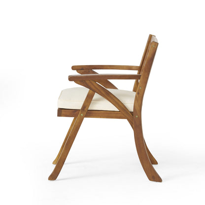 Outdoor acacia wood dining chair with beige cushion; curved armrests, slatted back on Tampa Home & Garden Store