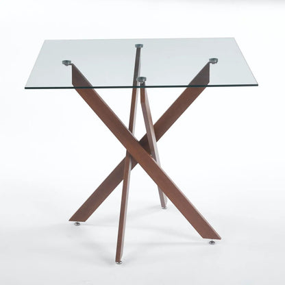 Dining table with square tempered glass top and crisscross wooden legs, modern space-saving design on Tampa Home & Garden Store