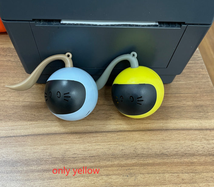 Pair of electric motion cat toy balls, blue and yellow with black cat-face decals on Tampa Home & Garden Store