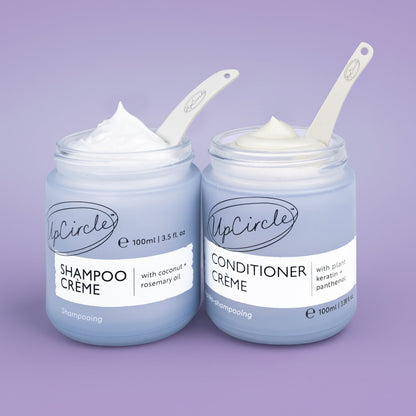 The Haircare Duo by UpCircle: Shampoo Creme + Conditioner Creme jars with white spatulas on Tampa Home & Garden Store