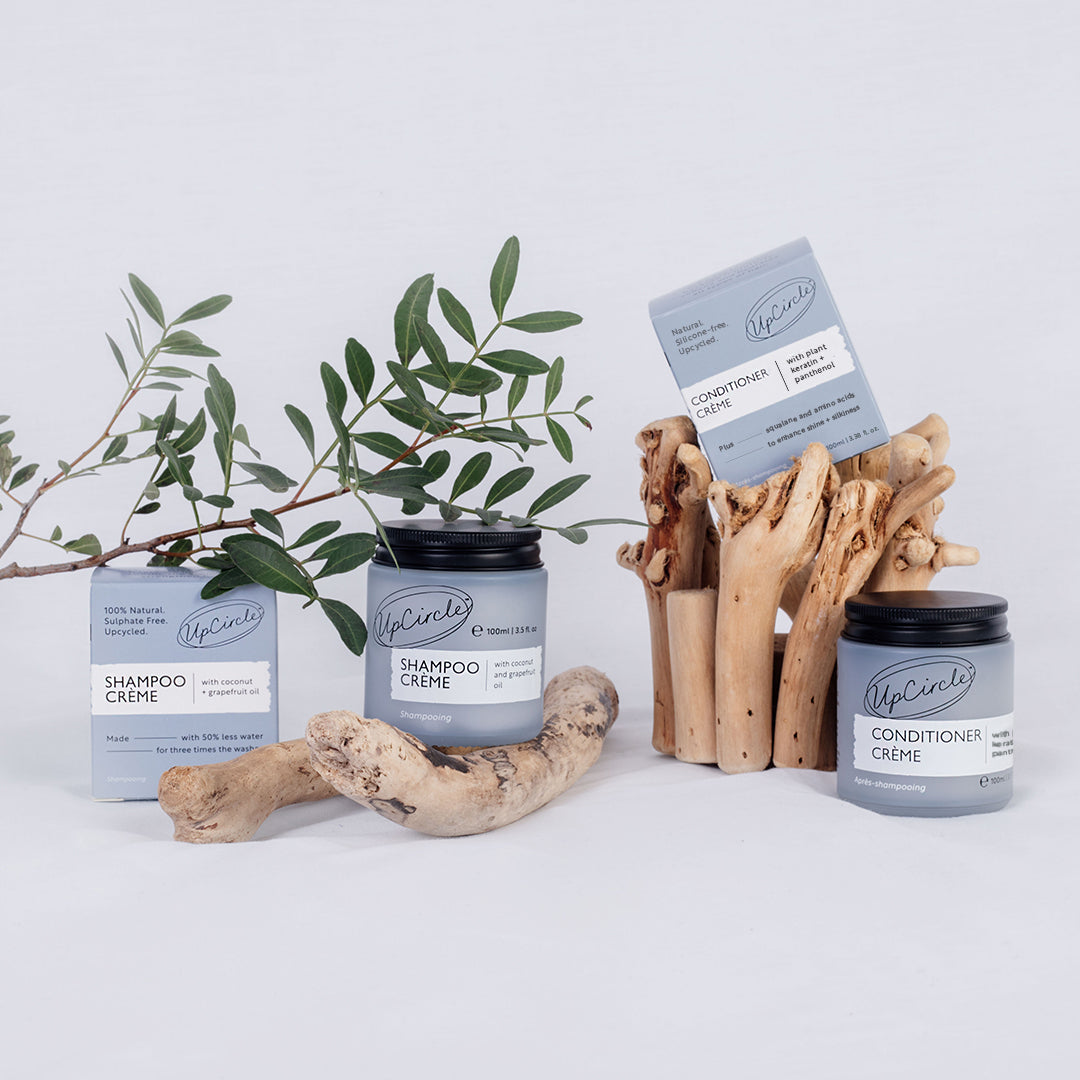 UpCircle Haircare Duo with pale blue Shampoo Creme and Conditioner Creme jars, black lids, on Tampa Home & Garden Store