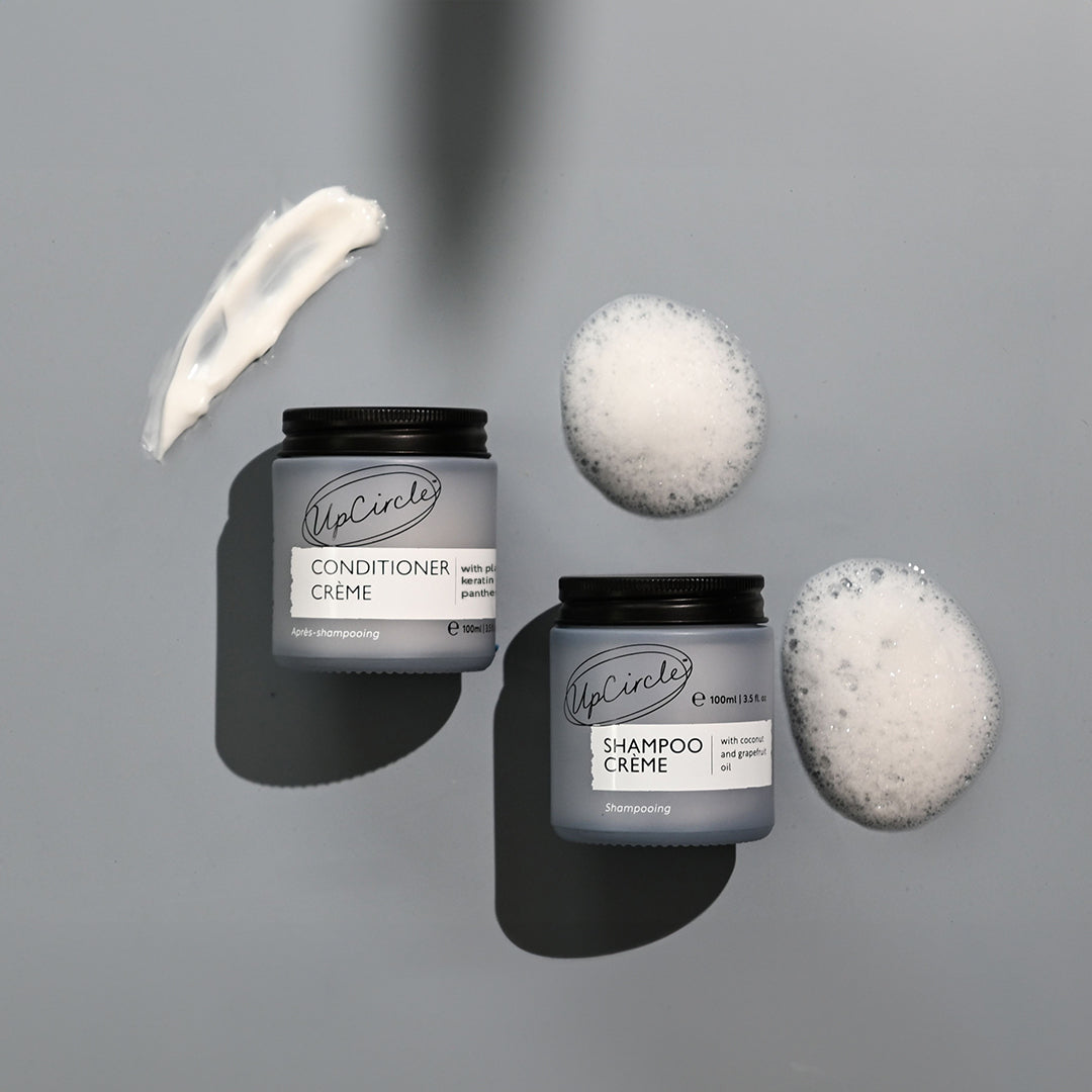 Shampoo Creme and Conditioner Creme duo jars by UpCircle in grey with black lids, bubbles on Tampa Home & Garden Store