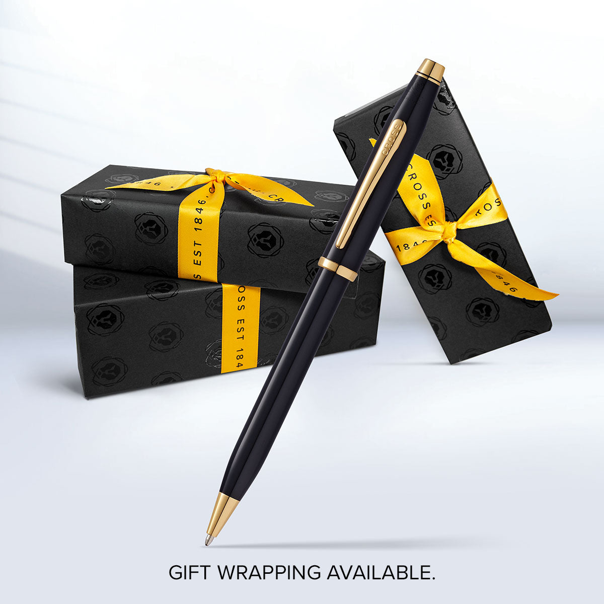 Century II Classic Black ballpoint pen by A.T. Cross with gold trim beside gift boxes on Tampa Home & Garden Store