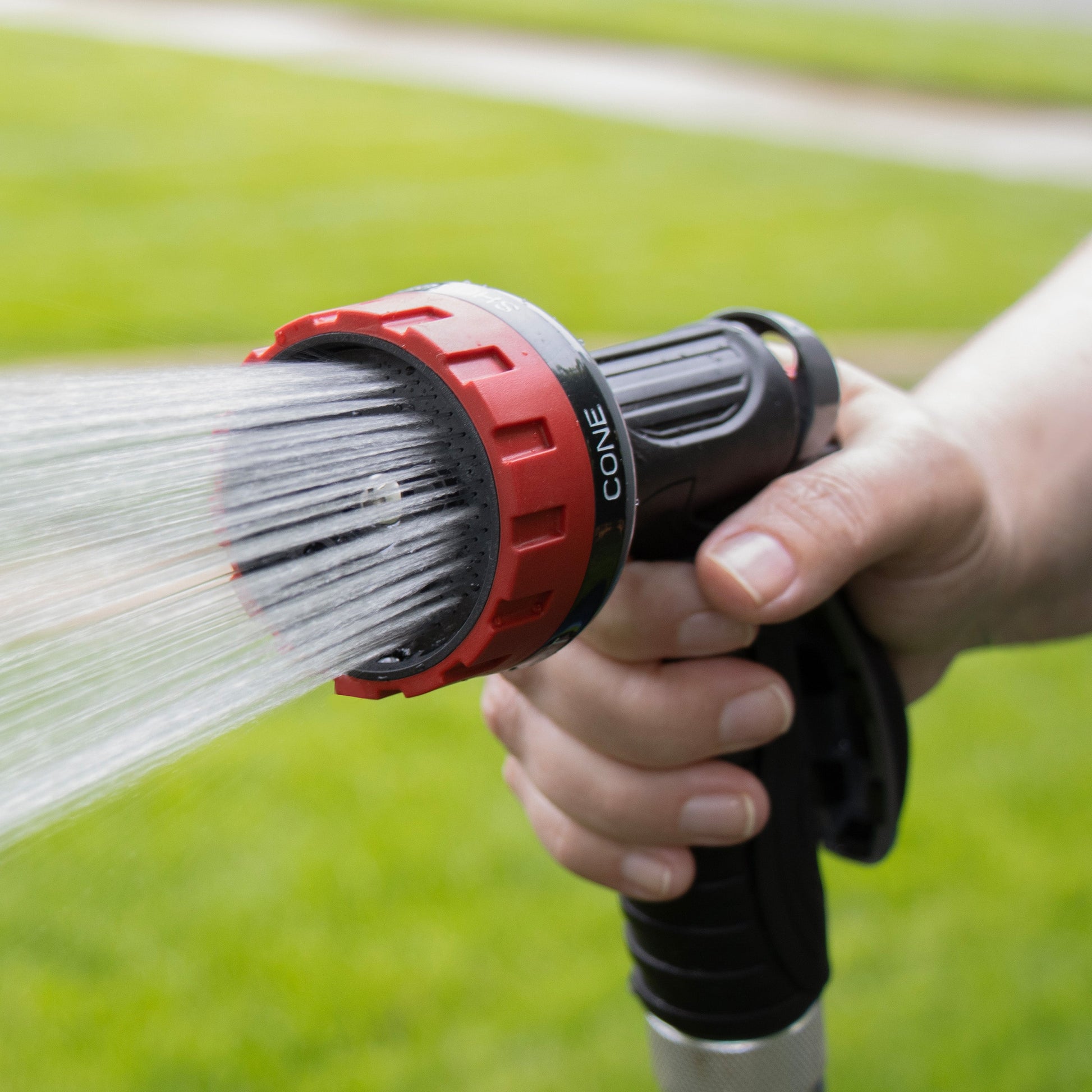 5-pattern zinc rear-trigger hose end spray nozzle by Orbit Irrigation with red ring on Tampa Home & Garden Store