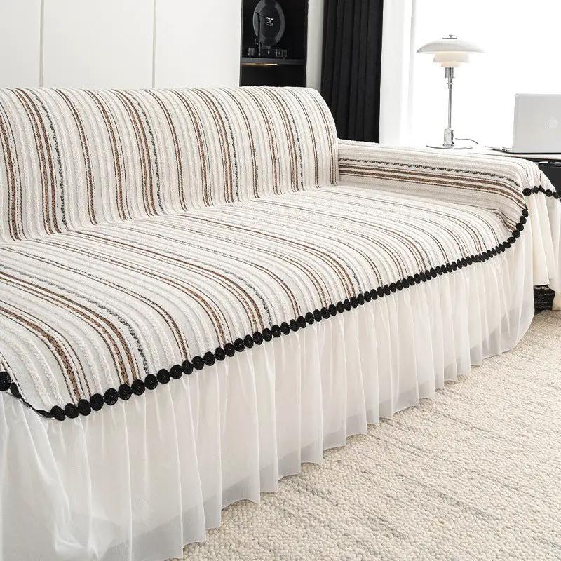 Striped sofa cover with white pleated skirt and black pom-pom trim by FLIPSTYLEZLLC on Tampa Home & Garden Store