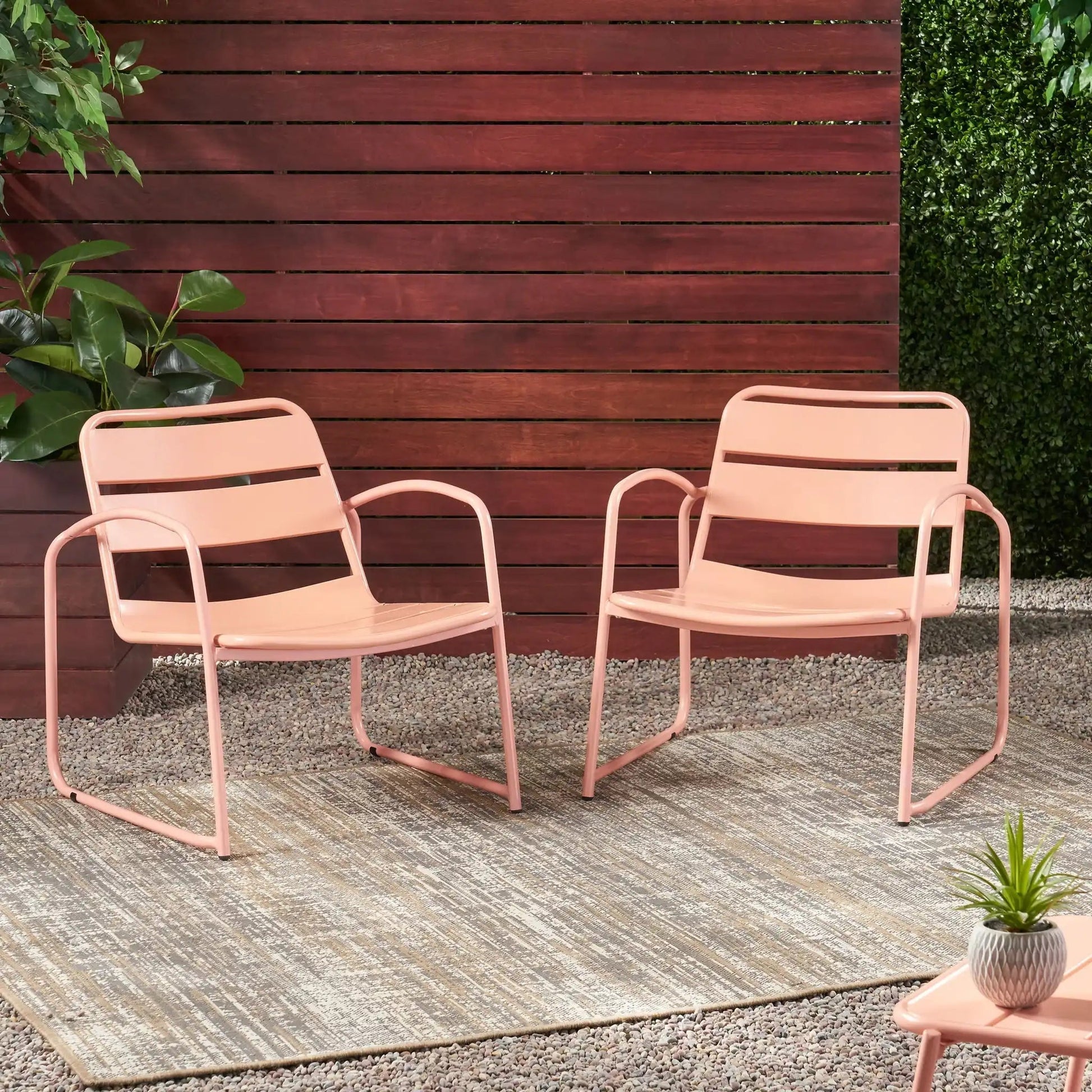 Conrad outdoor arm chairs by HouseOfZazla; blush pink metal frames with slatted seats on Tampa Home & Garden Store