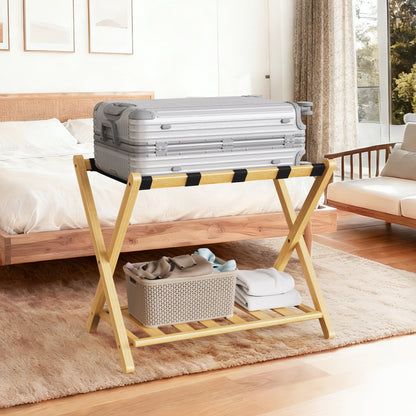 Folding bamboo luggage rack with lower shelf holding a silver suitcase in a bedroom on Tampa Home & Garden Store