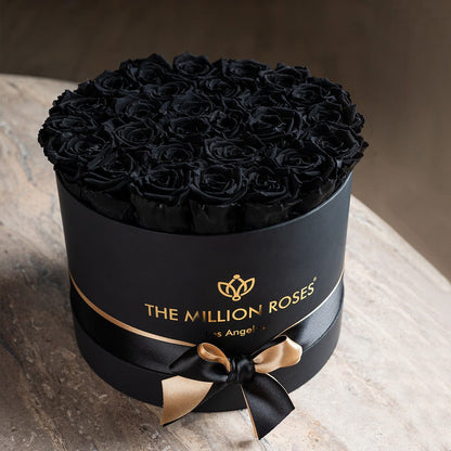 Supreme Black Box with black roses in a round hatbox by The Million Roses on Tampa Home & Garden Store