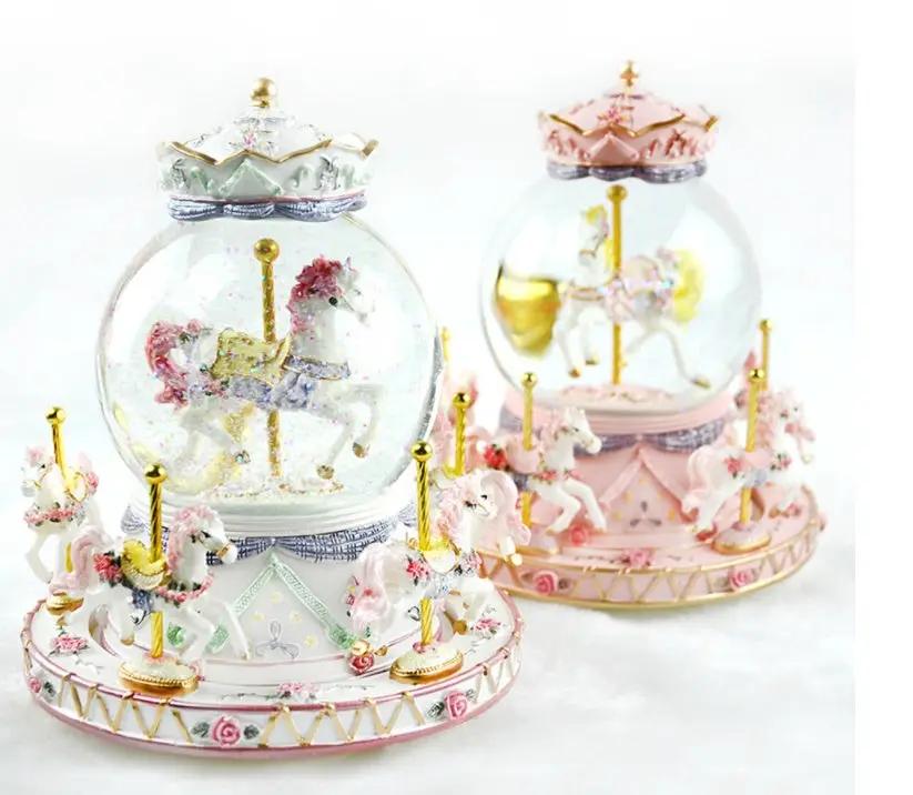 Crystal music box carousel set of 2 with glass globes, pink and mint bases, gold accents on Tampa Home & Garden Store