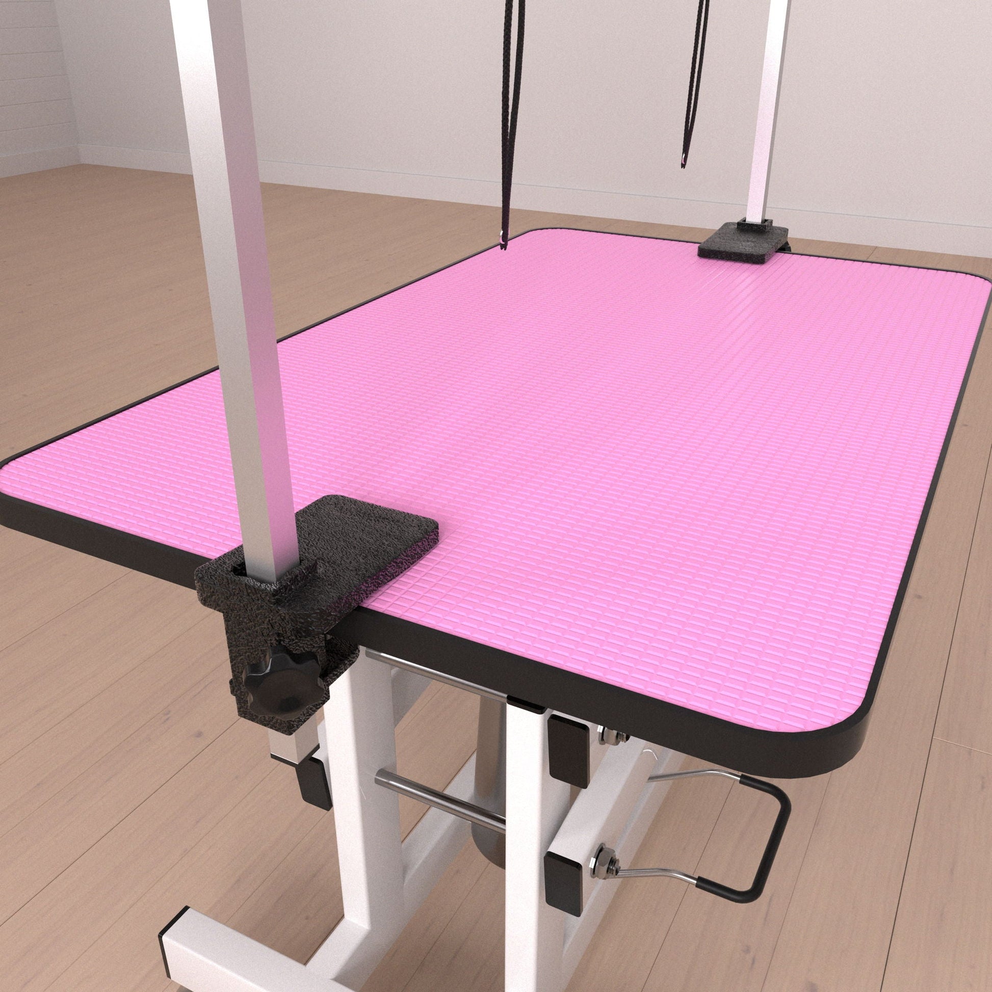 Hydraulic pet grooming table with H-arm, pink textured non-slip mat, black restraints on Tampa Home & Garden Store