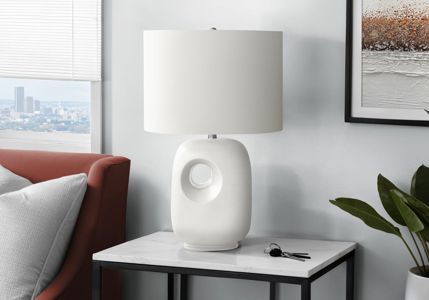 Table lamp HouseOfZazla, contemporary white ceramic with ivory shade atop a marble table on Tampa Home & Garden Store