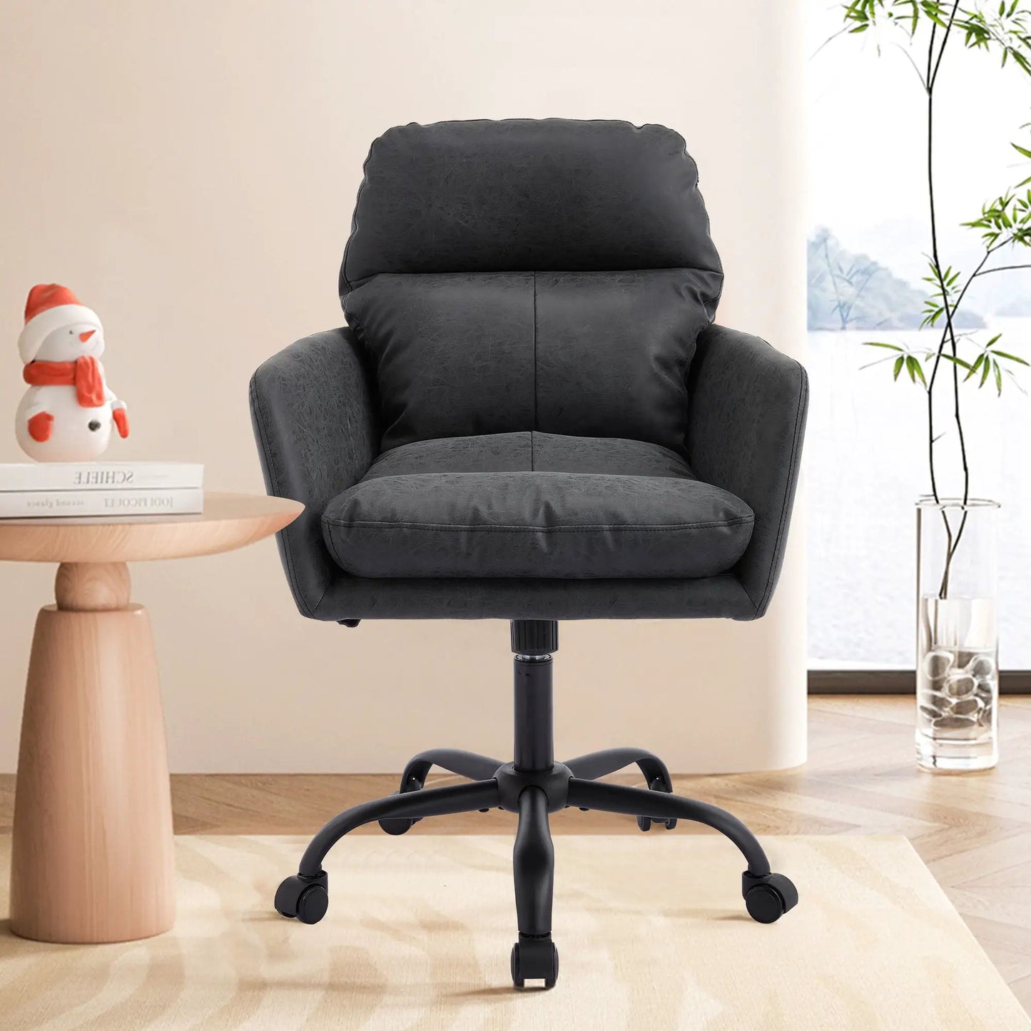 Office chair with adjustable height, black faux leather, ergonomic swivel; plant visible nearby on Tampa Home & Garden Store