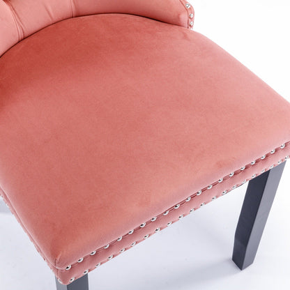 Tufted velvet dining chair set in coral pink with nailhead trim and dark wood legs on Tampa Home & Garden Store