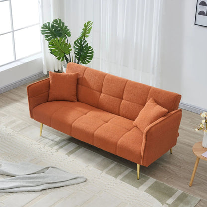 Convertible double futon sofa bed in orange textured fabric with folding armrests in a room on Tampa Home & Garden Store