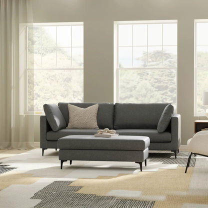 Ava - Mid Century Sofa, Upholstered in charcoal gray fabric; stationary sofa by Unique Piece Furniture in a bright living room on Tampa Home & Garden Store