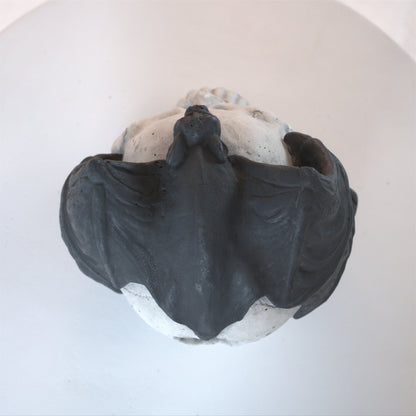 Hand-welded fire pit skull wall art set in dark gray with rough texture on Tampa Home & Garden Store