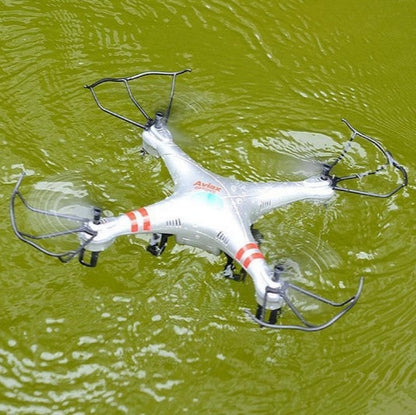Sell My Stuff X52 Drone toy quadcopter, white with red stripes floating on green water on Tampa Home & Garden Store