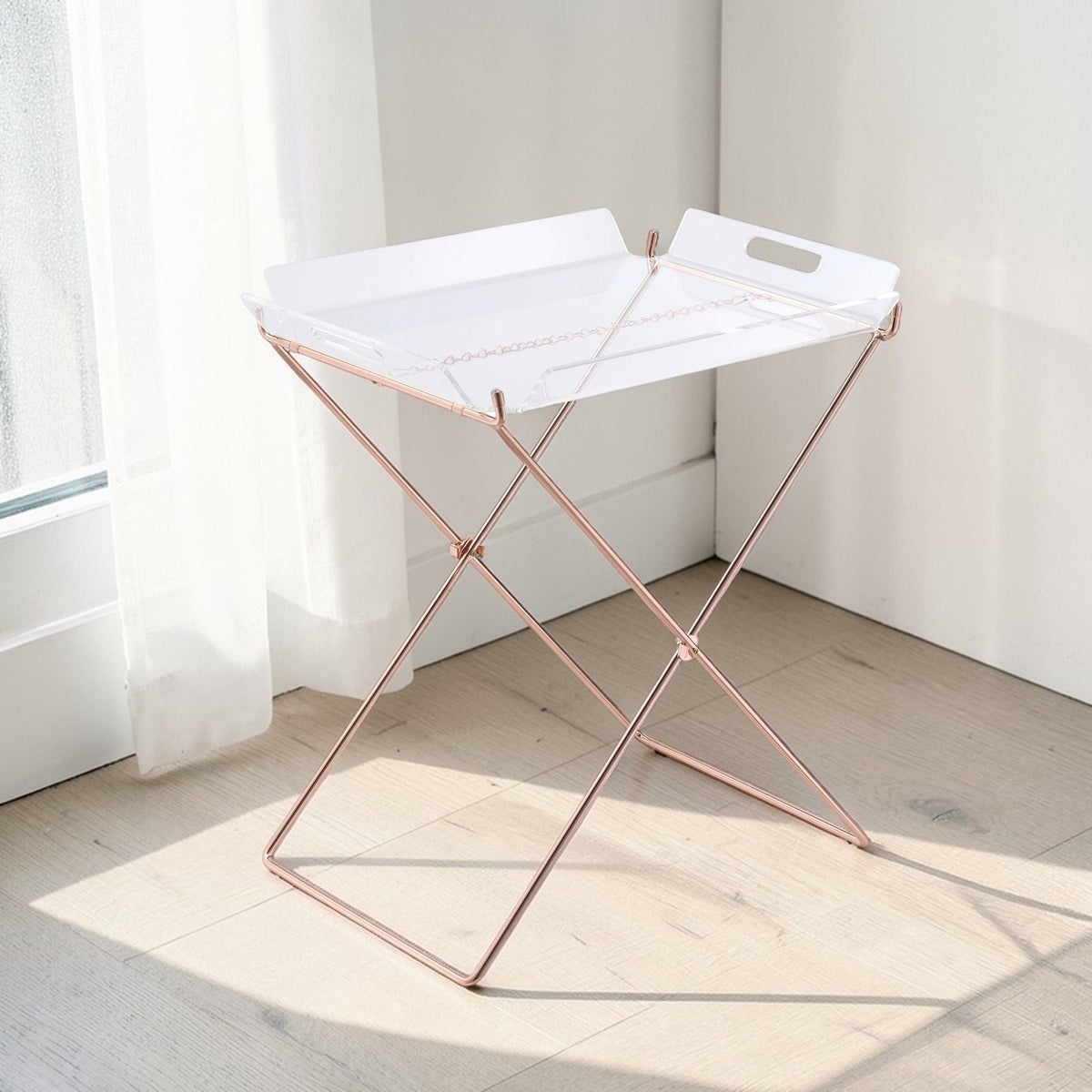 Clear acrylic tray table with removable top on a rose-gold X-frame stand on Tampa Home & Garden Store