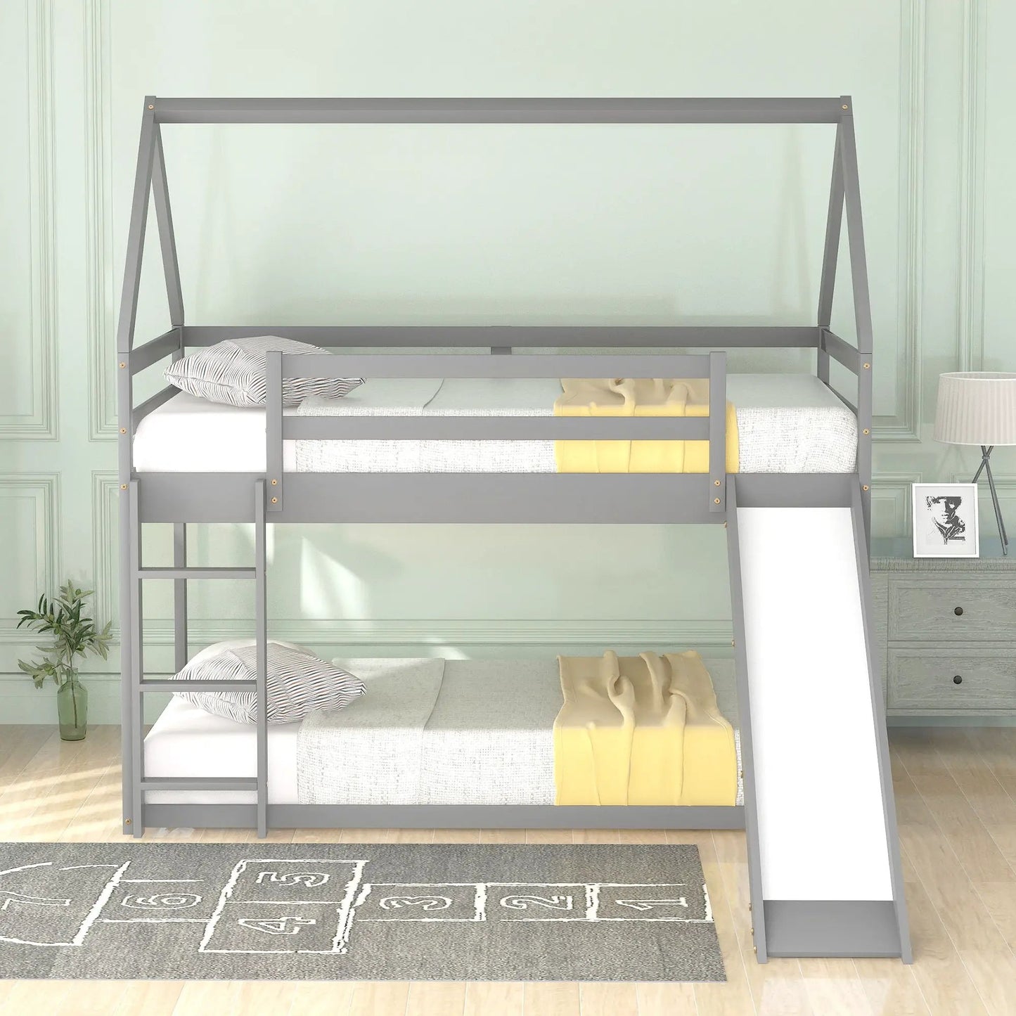 Gray metal house-shaped bunk bed with ladder; top and bottom twin beds on Tampa Home & Garden Store
