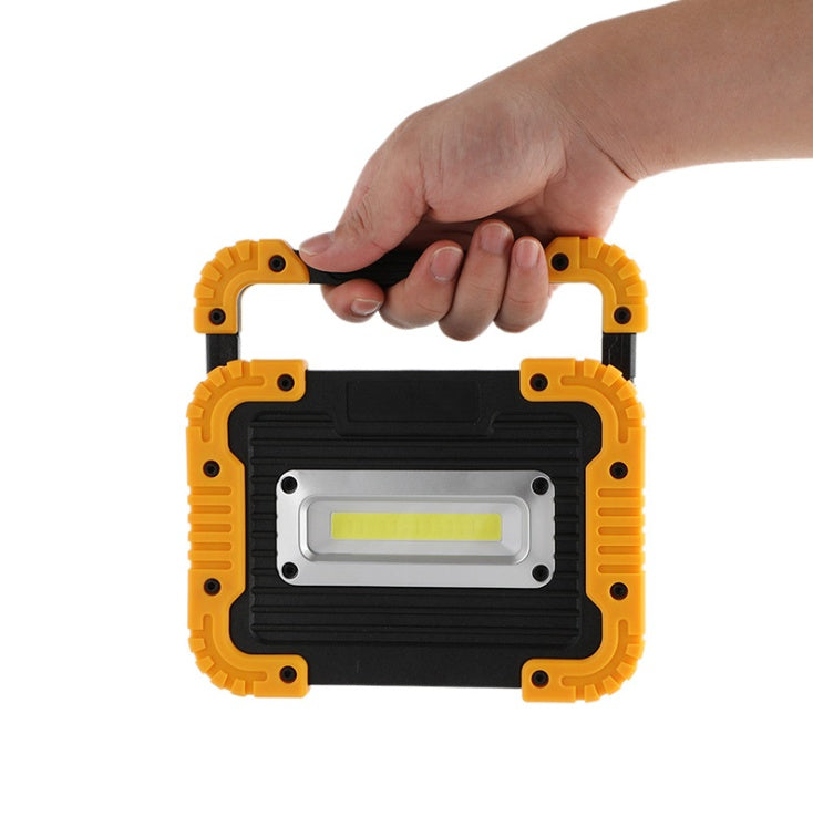 Rechargeable LED camping lantern by Sell My Stuff, handheld black unit with yellow corners on Tampa Home & Garden Store